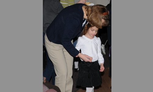 Children take communion with parental instruction